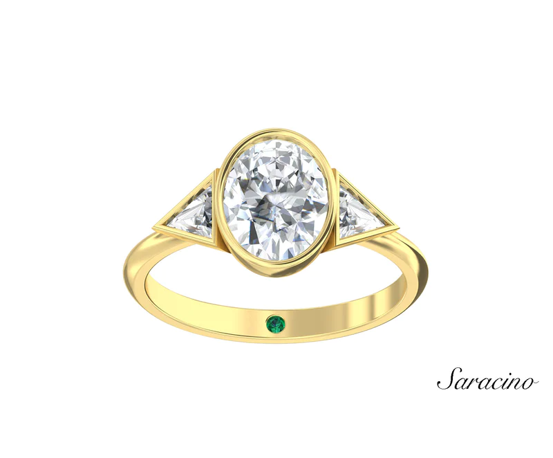 A yellow gold band oval diamond ring